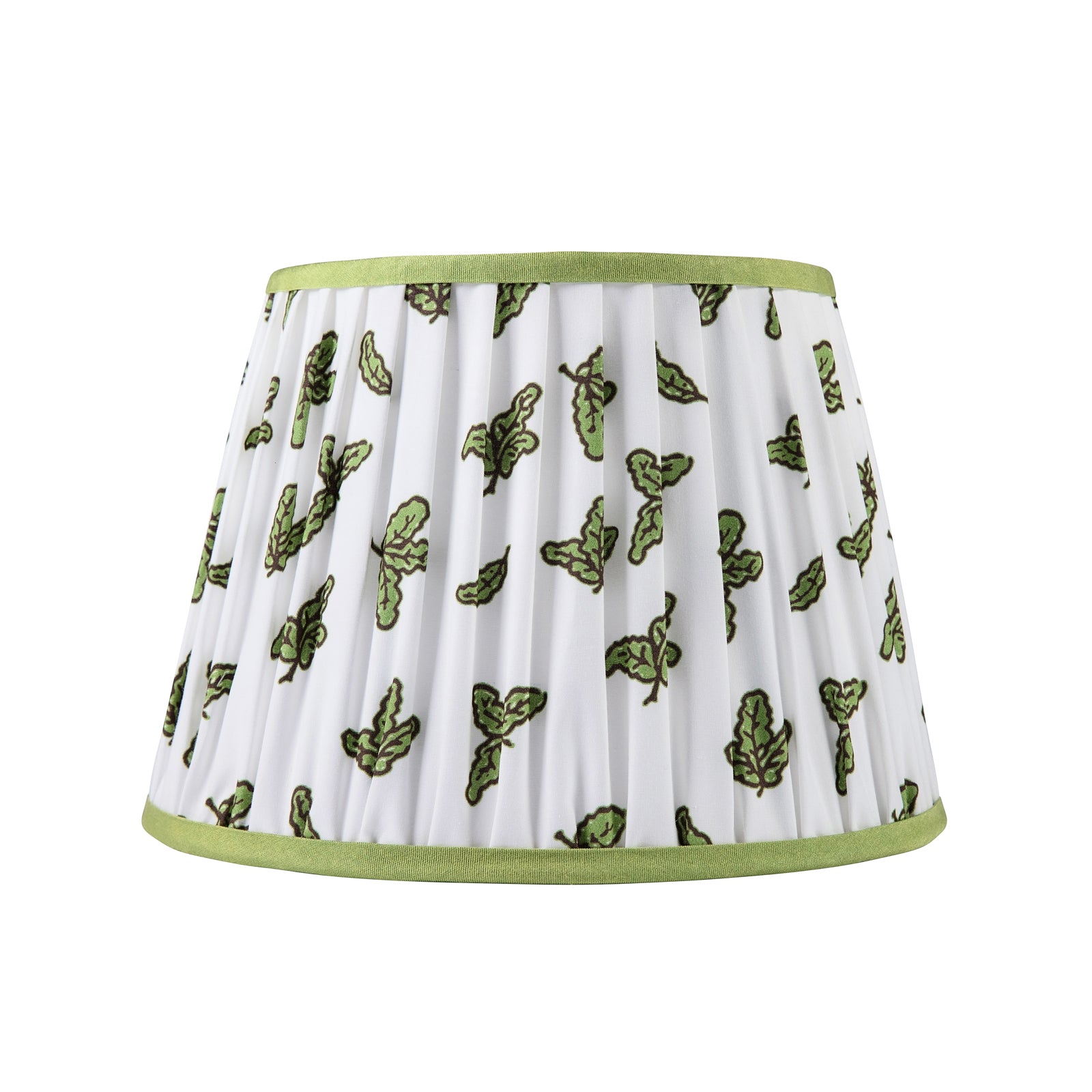 A white cotton lampshade with a green and peridot block print of oak leaves and acorns, gathered and trimmed.