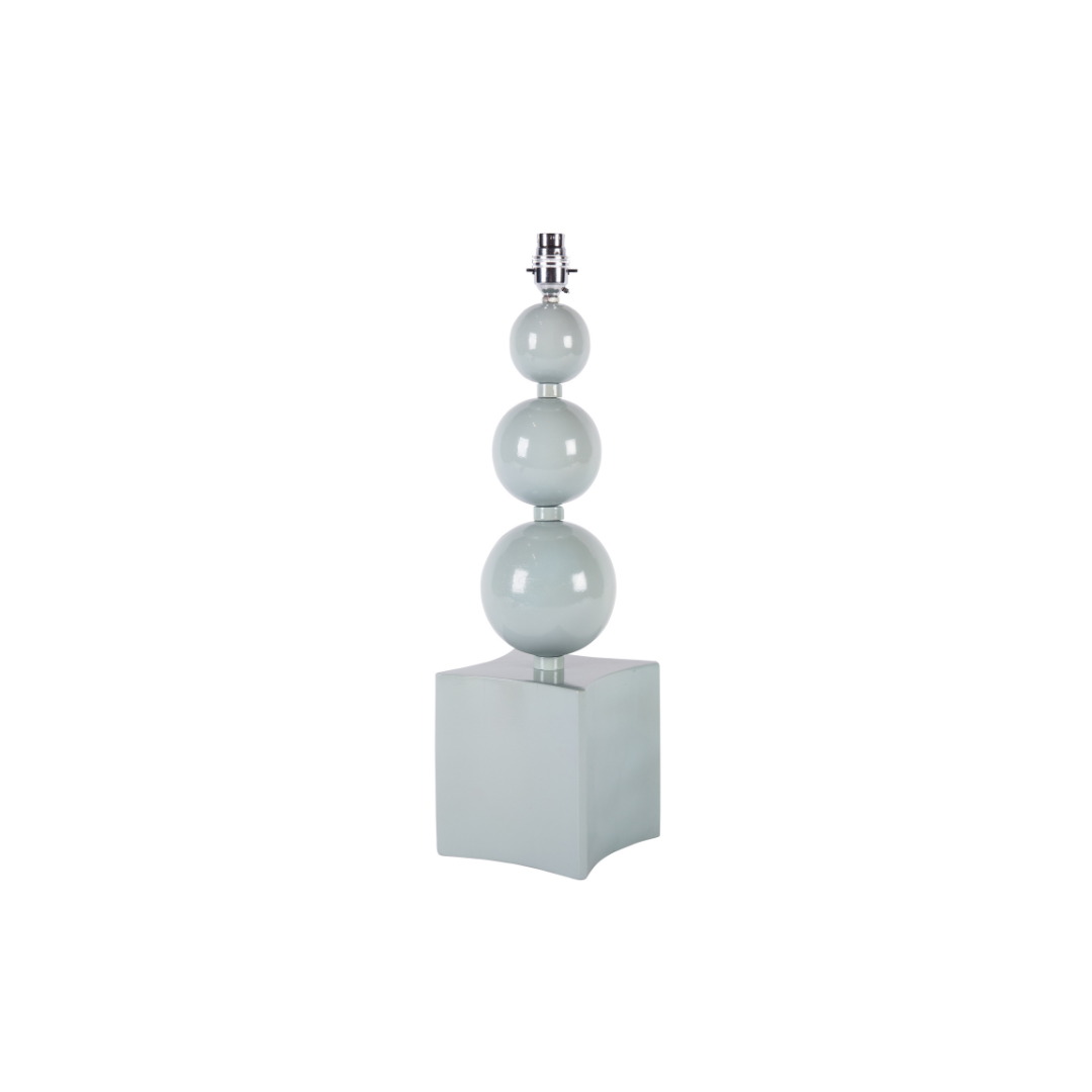 Table lamp with three spherical shades on a white background