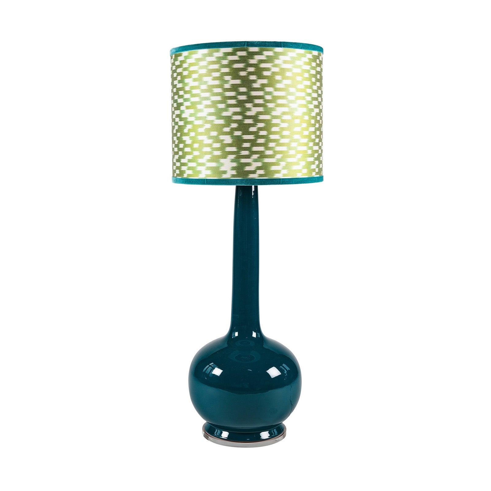 Beau Lamp in Dark Teal. Teal table lamp with a patterned green and white shade on a white background