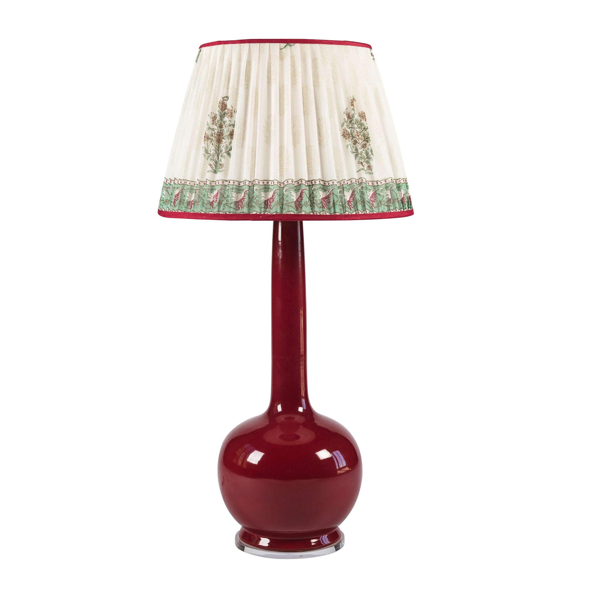 Beau_Lamp_in_Port_Example. Red lamp with a decorative white and green lampshade on a white background