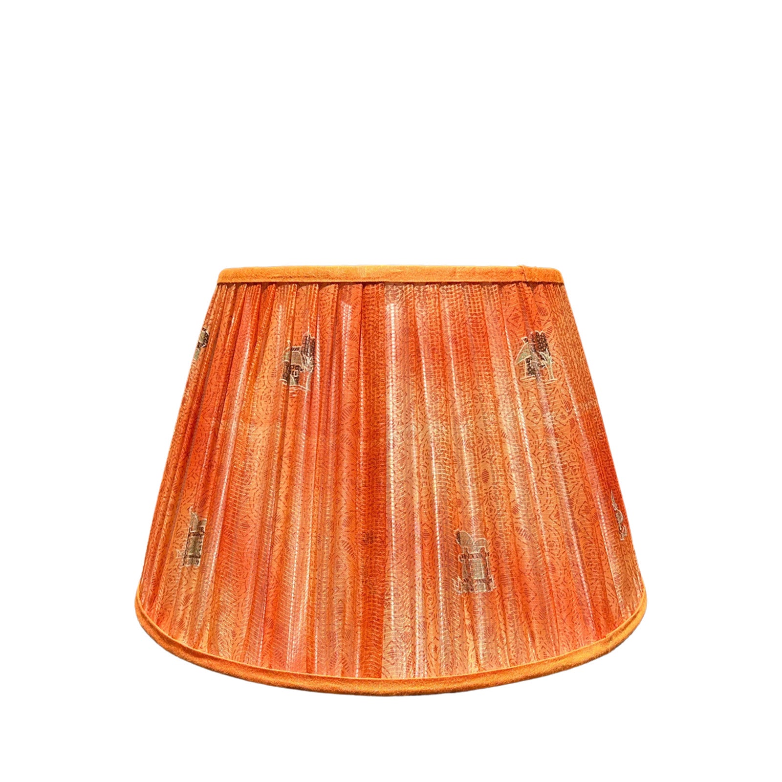An orange and coral pleated lampshade made from fabric, designed for luxury interiors.