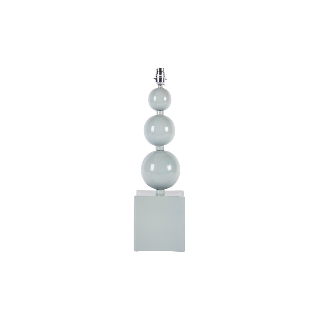 Decorative lamp with three spherical beads on a white background
