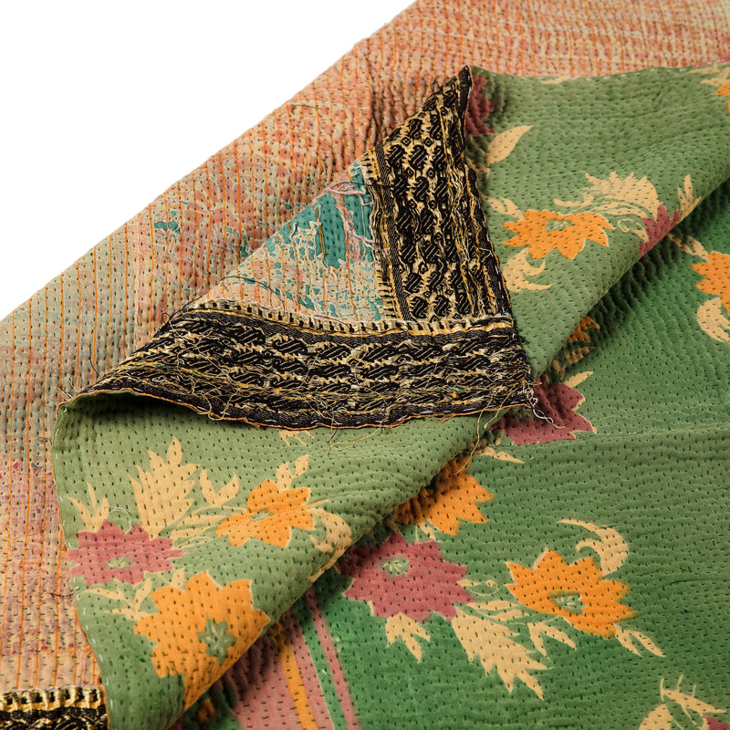 Large Multicoloured green and gold patterned bedspread.
