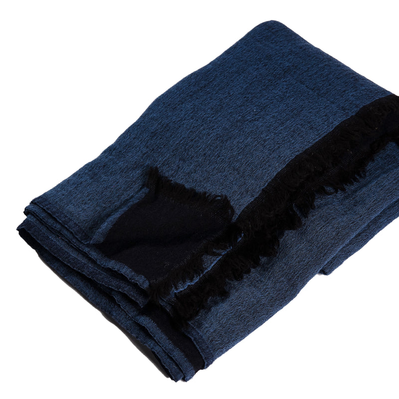 Large throw in Navy with a black back and fringe.