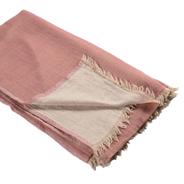 Large throw in blush with a cream back and fringe.