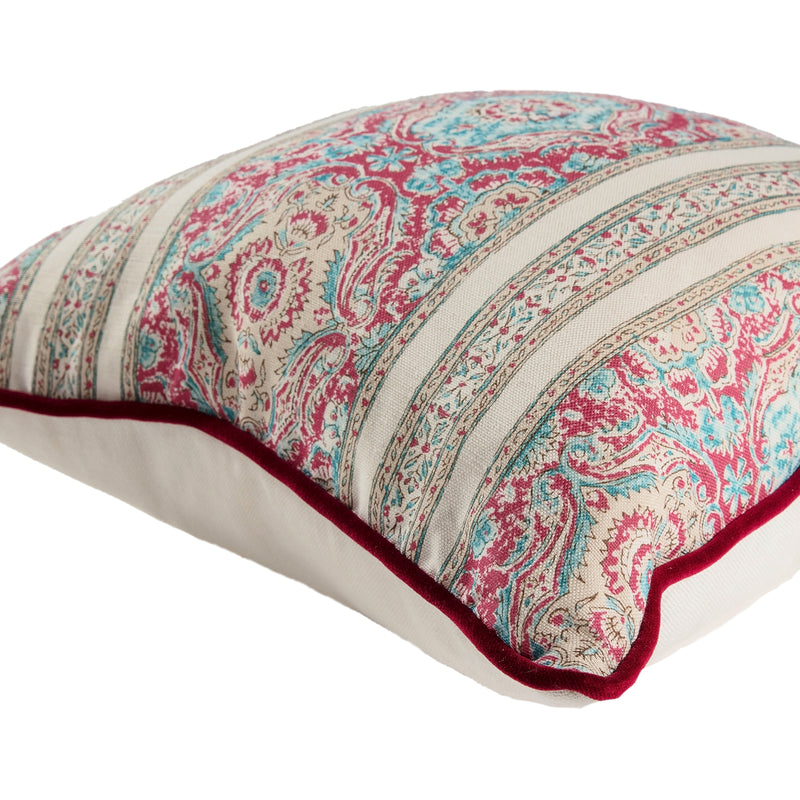 Pink and blue tapestry square cushion with velvet cherry piping.