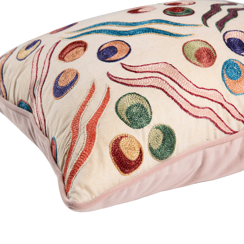 Limited Edition multicoloured patterned cushion with blush pink velvet piping and back