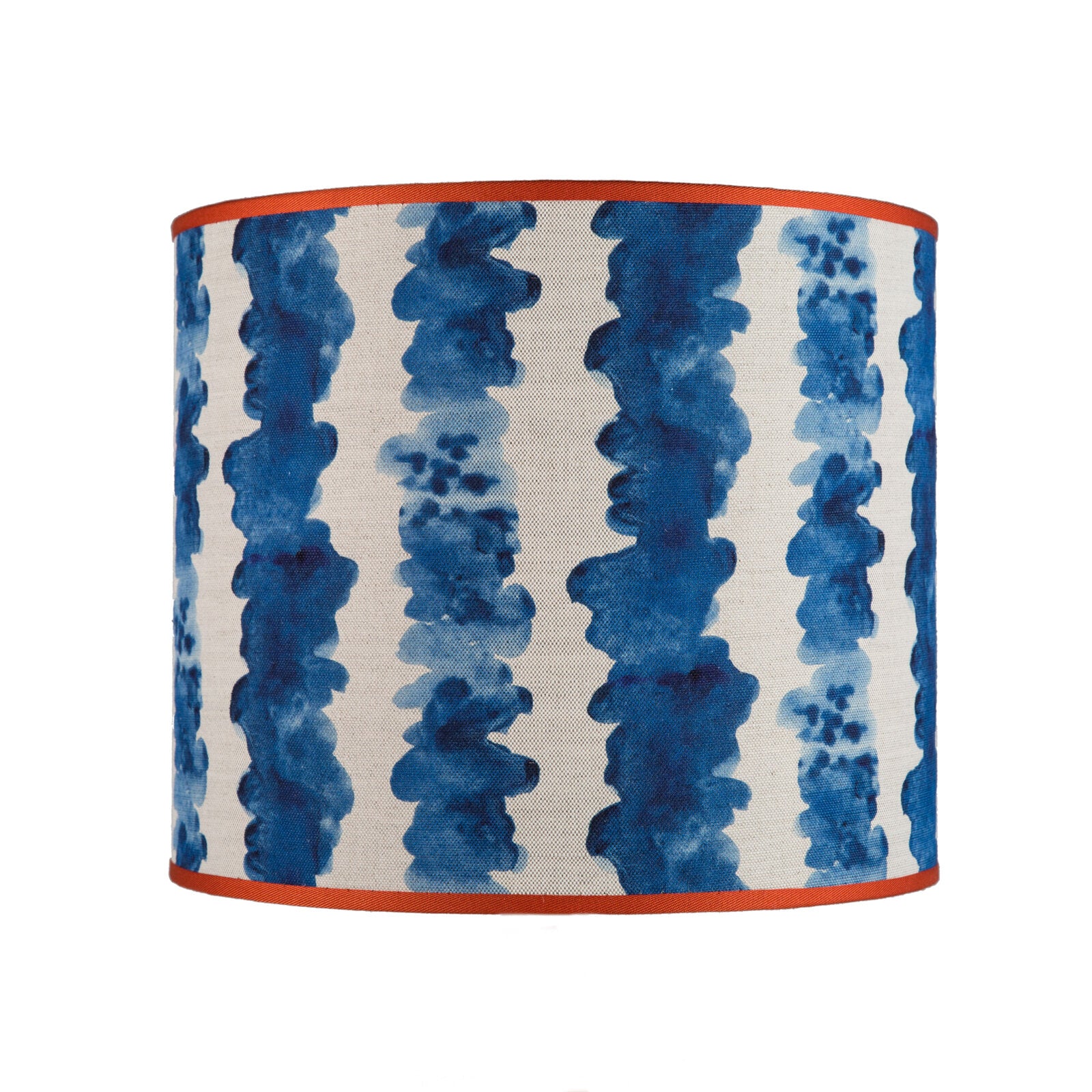 A cylindrical lampshade with a geometric pattern in blue tones on a white background.